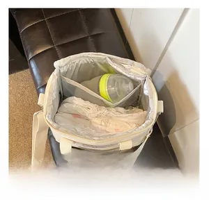 Interior view showing large capacity for baby bottles and diapers in the diaper bag