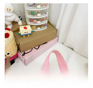 Close-up of wide padded light pink fabric handle for comfortable carrying on kids backpack