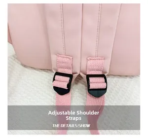 Detail view of pink backpack with adjustable strap buckle and durable nylon fabric