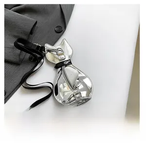 Detailed macro view showing the storage capacity of the cat shaped silver mirror bag