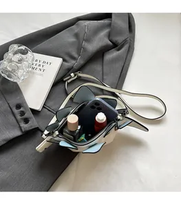 Internal view of creative fish-shaped crossbody bag showing space for phone and lipstick