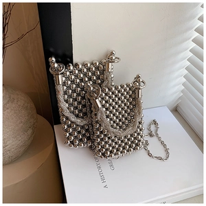 Detail of silver beaded bucket bags with rhinestone handles and chain straps