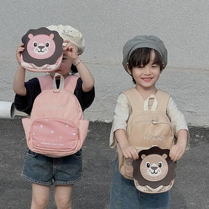 Cute lion cartoon backpack set for kids in pink and beige colors with a lion accessory