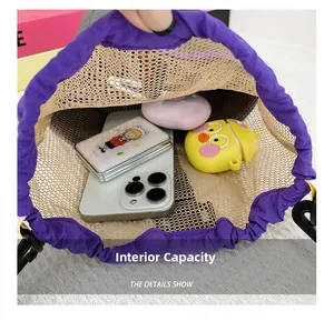 Detail showing the internal capacity of the purple mesh drawstring bag with daily items
