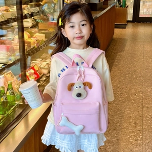 Pink kids backpack featuring cute 3D plush dog mascot and bone charm accessories