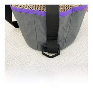 Detail of grey mesh nylon bag featuring purple trim and plastic D-ring buckle