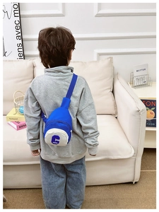 Detail showing dark blue nylon kids chest bag with white zipper pocket and letter print