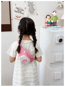 Pink and white patchwork kids chest bag with letter G embroidery worn by child