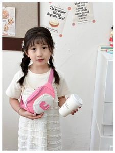 Pink and white canvas kids chest bag featuring a 3D G letter on a child model
