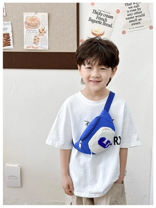 Close-up detail of blue and cream kids crossbody bag with letter C and Douding logo