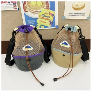 Detail of mesh drawstring kids bags featuring color-block design and adjustable straps