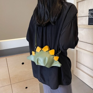 Cute green dinosaur crossbody bag for women with yellow plates and slender strap
