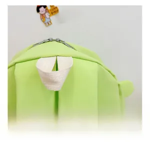 Detail of the durable nylon top handle and double metal zippers on the frog cartoon backpack