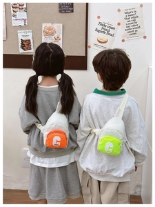 Kids trendy chest bags in vibrant orange and neon green with letter C patch embroidery