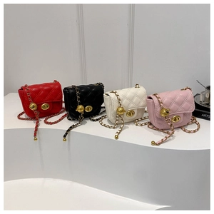 Detail view of mini quilted chain bags in red, black, white, and pink with metal ball adjusters