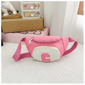 Detail view of pink and white kids chest bag with letter C and adjustable strap