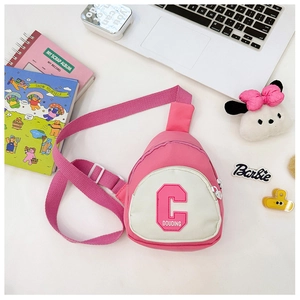 Detail of pink canvas kids chest bag with embroidered letters and adjustable strap