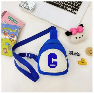 Close-up of blue and white nylon kids chest bag with letter C and zip pocket