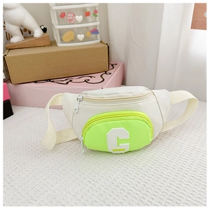 Detail view of the stylish kids chest bag with green pocket and 3D letter C embroidery