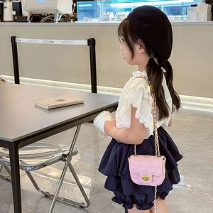 Pink quilted girls crossbody bag with gold chain strap and metal lock closure