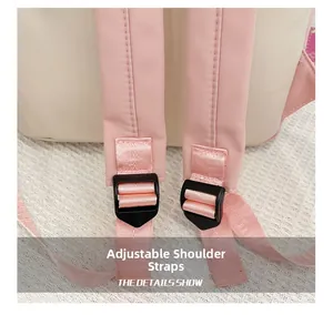 Detail of adjustable pink nylon shoulder strap with a black plastic buckle on kids backpack