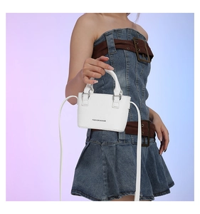 Close-up of white lychee pattern leather mini crossbody bag with Fashion & Bags logo