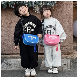 Kids casual street style set featuring logo sweatshirt and crossbody messenger bag detail