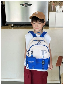 Blue and white color-block kids backpack with UP logo and matching small coin purse
