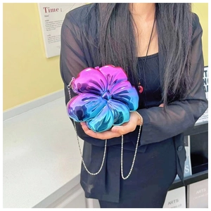 Detailed view of 3D flower-shaped gradient metallic shoulder bag with silver ball chain