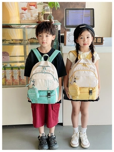 Kids fashion backpack set with functional buckles and a small round zipper pouch detail