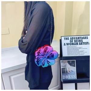 Detail of 3D flower shoulder bag with purple blue gradient and silver chain strap