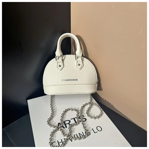 Detail of white mini shell bag with litchi texture, metal chain, and Fashion & Bags text