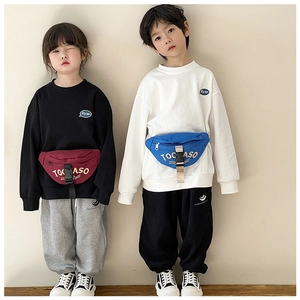 Detail of Korean-style kids canvas crossbody bag with bold TOCASO letter print