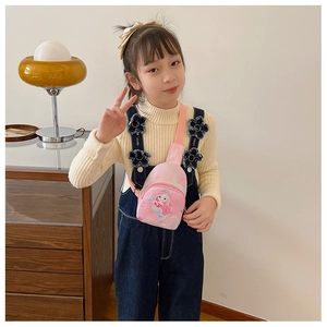 Pink cartoon mermaid chest bag for kids worn by a little girl in a cozy indoor setting