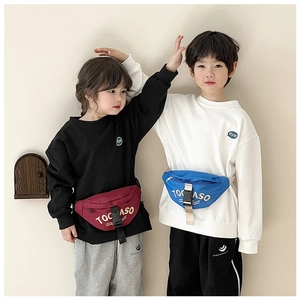 Detail view of stylish kids canvas fanny packs in burgundy and royal blue with letter print