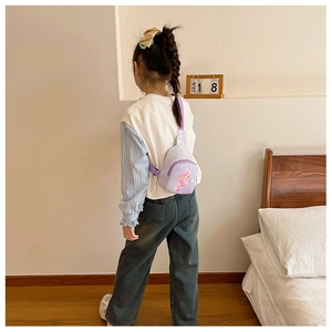 Detail of a purple mermaid princess chest bag for kids showing back strap fit and size