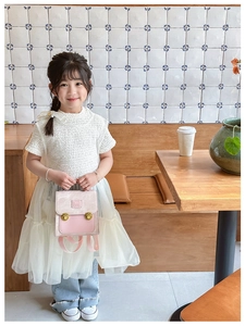 Pink and beige colorblock toddler backpack with bear logo and golden buckle detail
