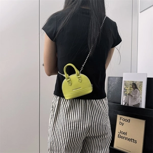 Neon lime shell shoulder bag with metal bead chain and pebble leather texture