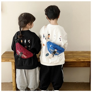 Close-up of stylish burgundy and blue canvas waist bags with adjustable straps on children