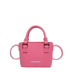 Minimalist pink small square handbag with pebble grain leather and silver ring handles