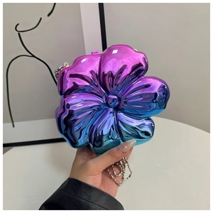 Close-up of flower-shaped metallic crossbody bag with colorful gradient finish and chain