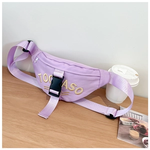 Detail view of a purple nylon kids waist bag featuring gold TOO ASO embroidery on wood