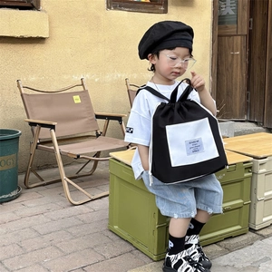 Fashionable black and white contrast drawstring backpack for kids with a canvas texture