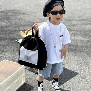 Kids black and white canvas drawstring backpack with stylish pockets for outdoor use