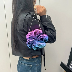 Floral crossbody chain bag with purple-blue gradient and metallic finish on model