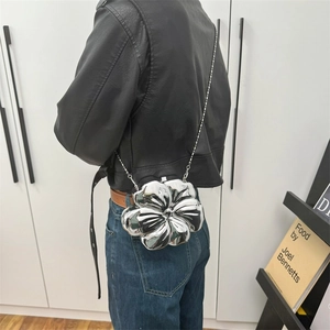 Silver metallic flower-shaped crossbody chain bag for women in avant-garde style