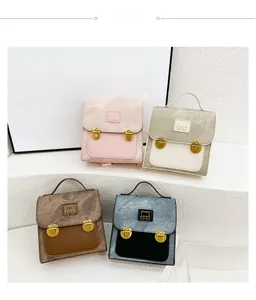 Detail view of four multi-colored bear backpacks with vintage metal clasps and handles