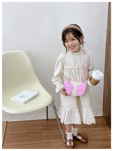 Detailed view of a sweet cartoon butterfly crossbody bag for girls with pink wings
