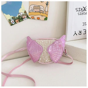 Detailed view of pink sequin butterfly wing crossbody bag for kids with glossy finish
