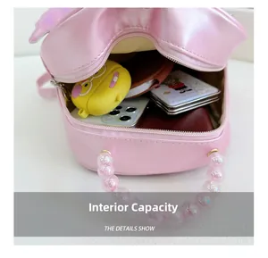 Internal view of pink toddler backpack showing space for a phone and accessories